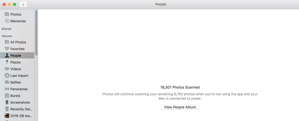Picture of Photos app with 18,000 photos remaining to scan.